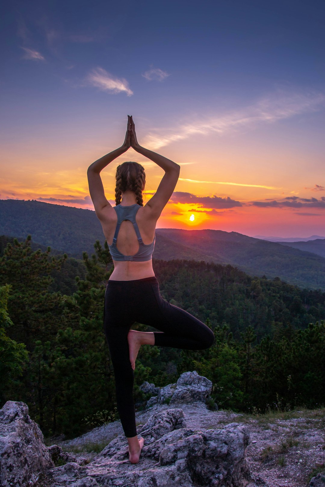 Offerings woman-in-black-leggings-standing-on-rock-formation-during-sunset-cxnglqf7xdo